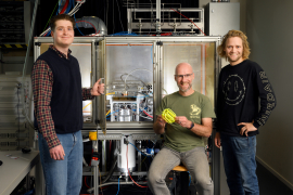 Jonas Gans, Hans Vullers and Nick Maes next to the heat exchanger