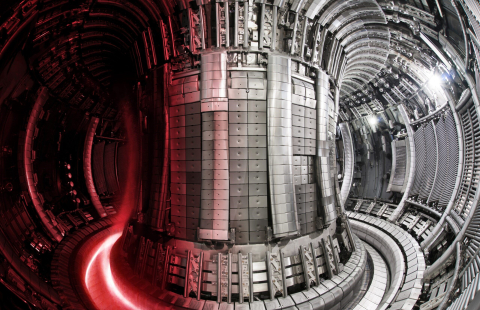 Inside the Joint European Torus tokamak (JET) at Culham, UK, with a superimposed image of the hot plasma. Credit: UKAEA, courtesy of EUROfusion
